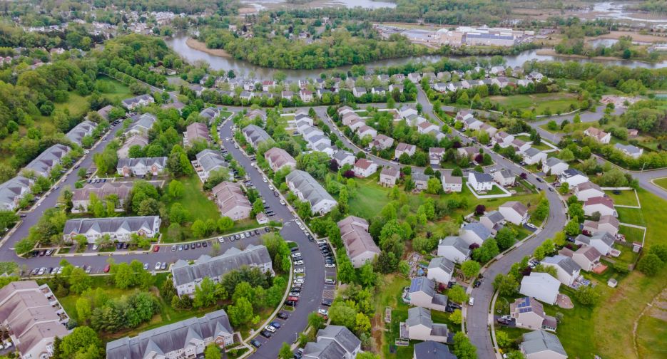 A small town from a height suburban neighborhood with houses A small town from a height suburban neighborhood with roofs of houses urban landscape